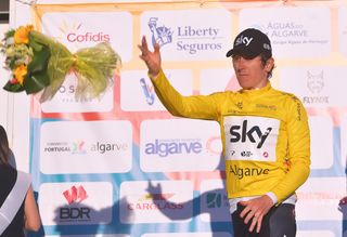 Geraint Thomas tosses his bouquet from the stage 2 podium at Volta ao Algarve