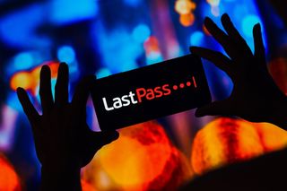 LastPass logo displayed on a smartphone with multi-colored blurry background