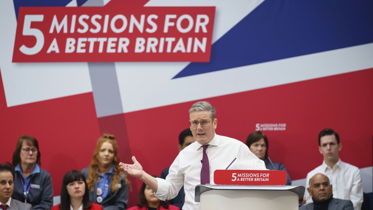 Keir Starmer speaking at a podium with a backdrop reading &amp;quot;5 missions for a better Britiain&amp;quot; 