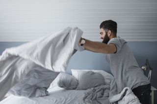 Man making bed