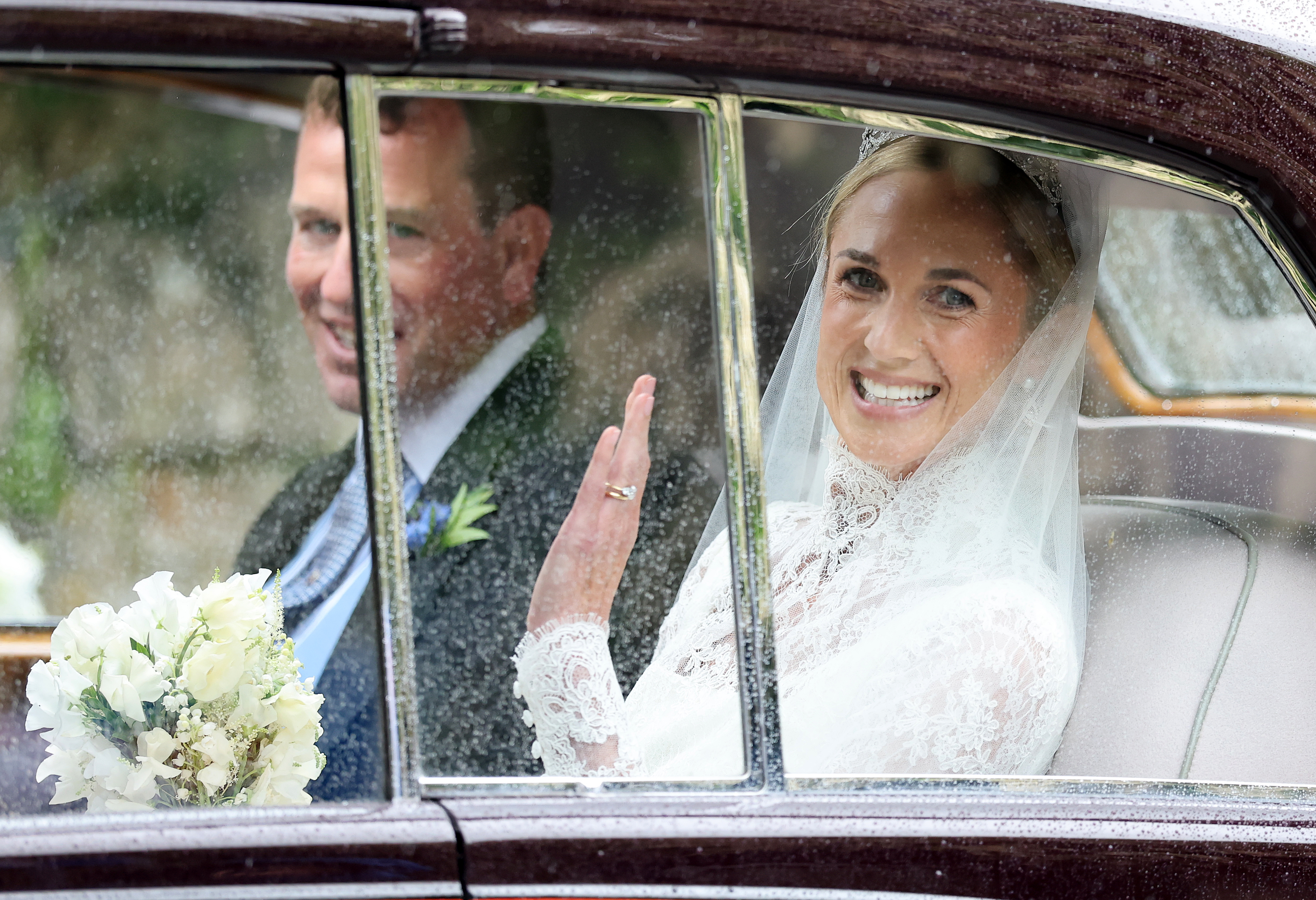 Harriet Sperling and Peter Phillips in a car on their wedding day