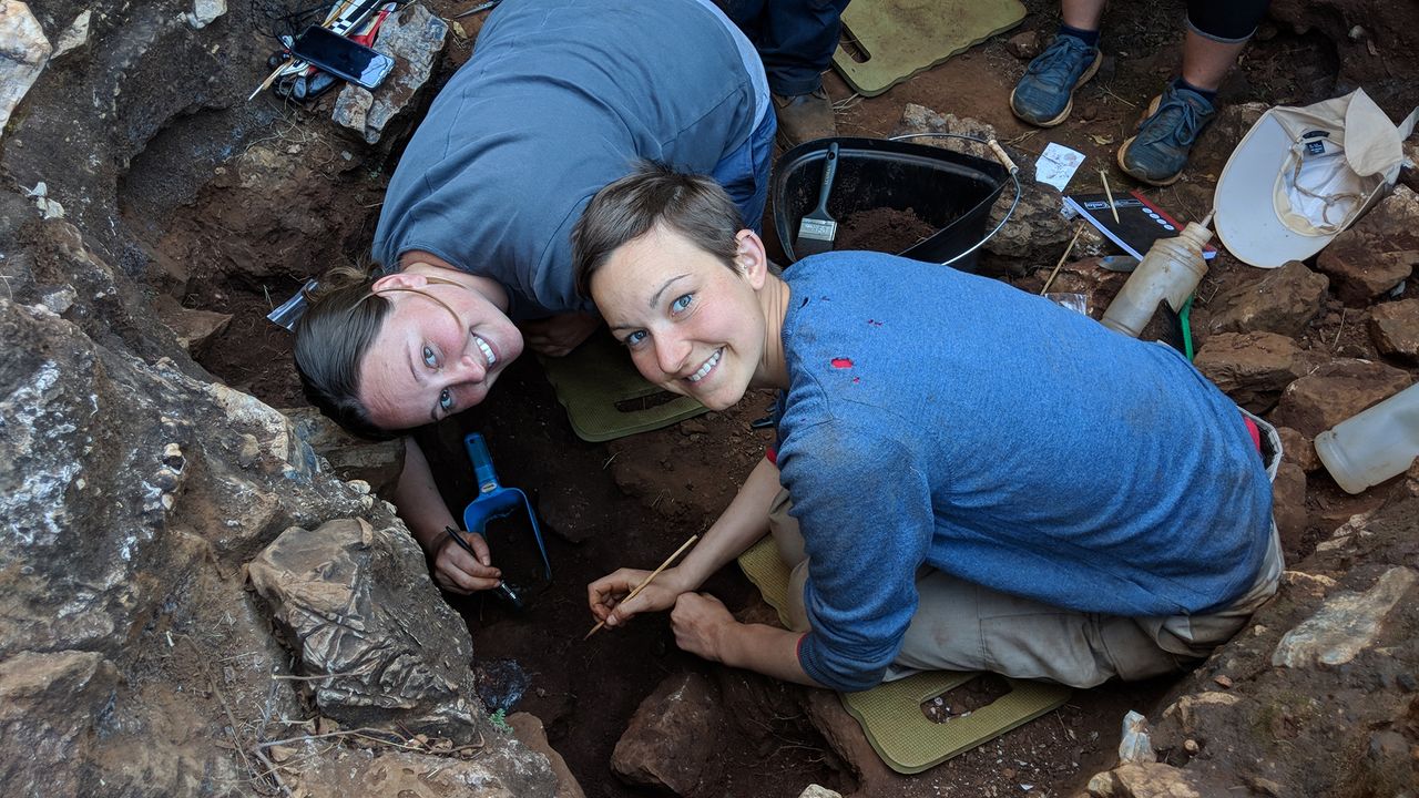 Study researchers Angeline Leece and Stephanie Baker help excavate the skull.