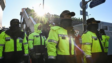 Police keep watch as supporters of South Korea's impeached President Yoon Suk Yeol gather near his residence in Seoul