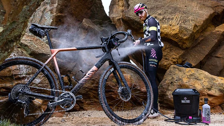 Alec Briggs using the Muc-Off Pressure Mobile Pressure Washer on a Canyon gravel bike