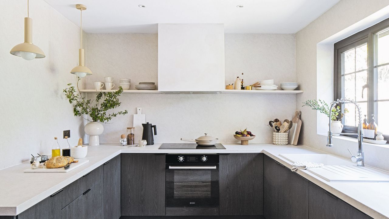 Grey and white kitchen countertops and storage units with appliances