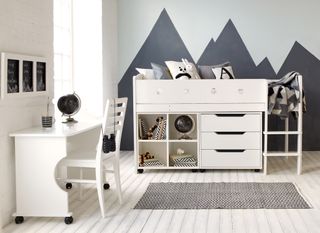 kids room with storage bunkbed, a desk and a mountain wall mural