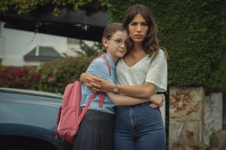 Who is Erin Carter? still from the Netflix thriller, mum Erin Carter (Evin Ahmad) and daughter Harper holding each other