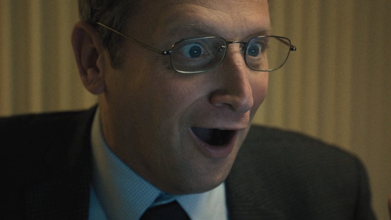 Ron with giant smile on face in The Chair Company Episode 6