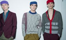 Male models wearing the Bottega Veneta Spring / Summer 2016 collection. They have a casual look and all three models are wearing colourful beanies