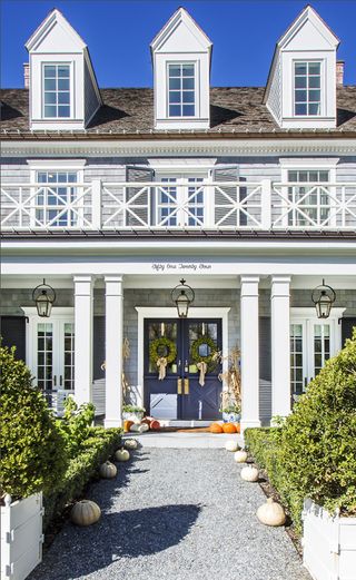 large home with fall porch decor
