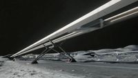 an elevated railroad-like structure on a grey dusty landscape