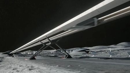 an elevated railroad-like structure on a grey dusty landscape
