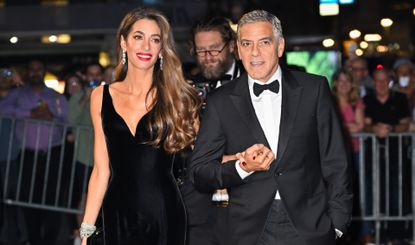 Amal Clooney and George Clooney at the Albies in Versace