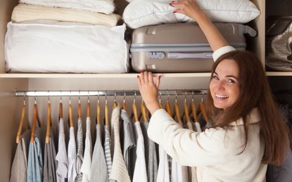 Woman following the KonMari Method of tidying up - but does it work?