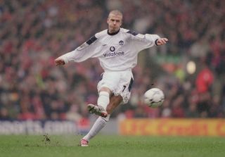 Manchester United's David Beckham hits a free-kick against Liverpool at Anfield in 2001.