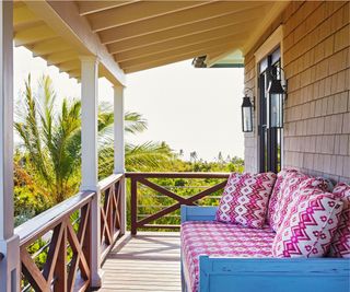 Balcony with pink outdoor couch