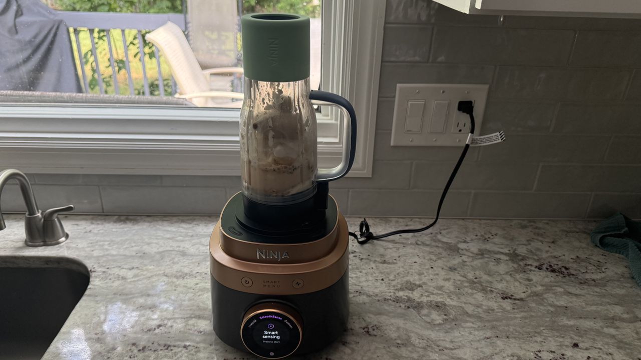 Ninja CrushBOSS making banana peanut butter smoothie