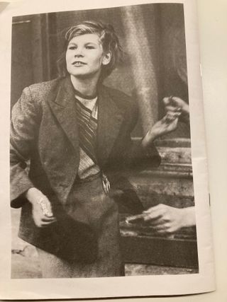 Photograph of a page in a book with a woman on it