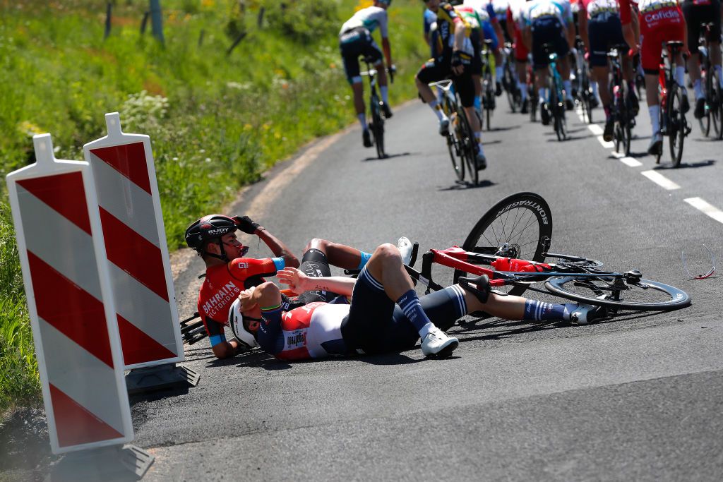 SAINT HAON LE VIEUXON FRANCE JUNE 01 Mads Pedersen of Denmark and Team Trek Segafredo Santiago Buitrago Sanchez of Colombia and Team Bahrain Victorious involved in a crash during the 73rd Critrium du Dauphin 2021 Stage 3 a 1722km stage from Langeac to Saint Haon Le Vieuxon Injury UCIworldtour Dauphin dauphine June 01 2021 in Saint Haon Le Vieuxon France Photo by Bas CzerwinskiGetty Images