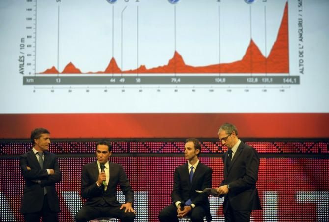 Former Spanish cyclist Perico Delgado, Vuelta 2012's winner Alberto Contador, Spanish cyclist Alejandro Valverde and Spanish journalist Carlos de Andres take part in the Vuelta presentation