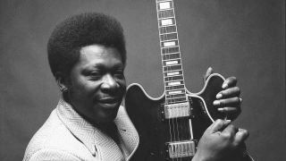 BB King holding his guitar