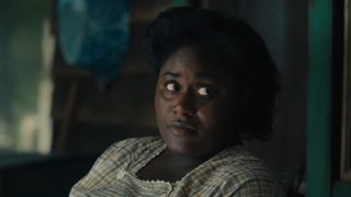 Danielle Brooks looking to the side as Sofia in The Color Purple.