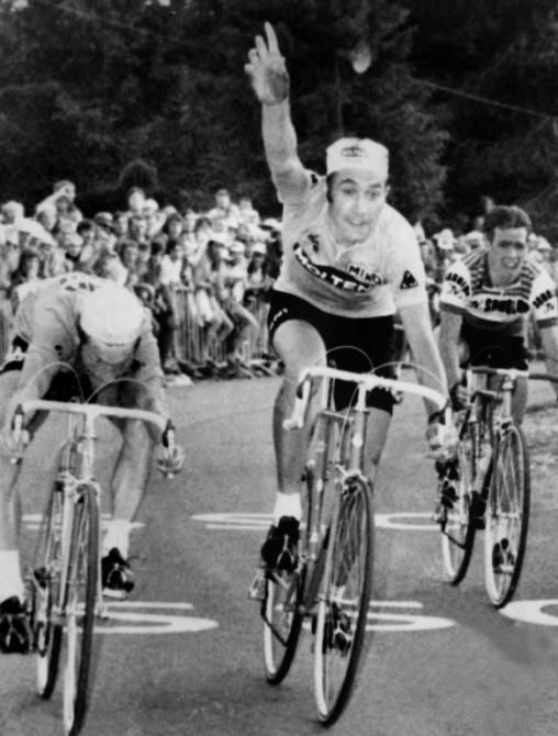 Belgian Eddy Merckx, wearing the yellow jersey as leader of the Tour de France, raises his arm thinking he has beaten Frenchman Cyrille Guimard (L) to the finish line of the 15th stage between Aix-les-Bains and Mont Revard. The jury decided otherwise and awarded the victory to Guimard, Belgian Lucien Van Impe (R) finishing third.