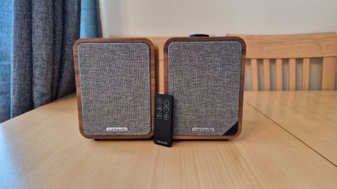 Ruark MR1 Mk2 Bluetooth Speakers Review image showing both speakers next to one another with the remote control leaning against the front of them