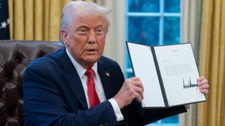 US President Donald Trump holds a signed executive order during a ceremony in the Oval Office of the White House in Washington, DC, US, on Monday, Feb. 3, 2025. Trump signed an executive action he said would direct officials to create a sovereign wealth fund for the US, following through on an idea he floated during the presidential campaign. Photographer: Chris Kleponis/CNP/Bloomberg via Getty Images