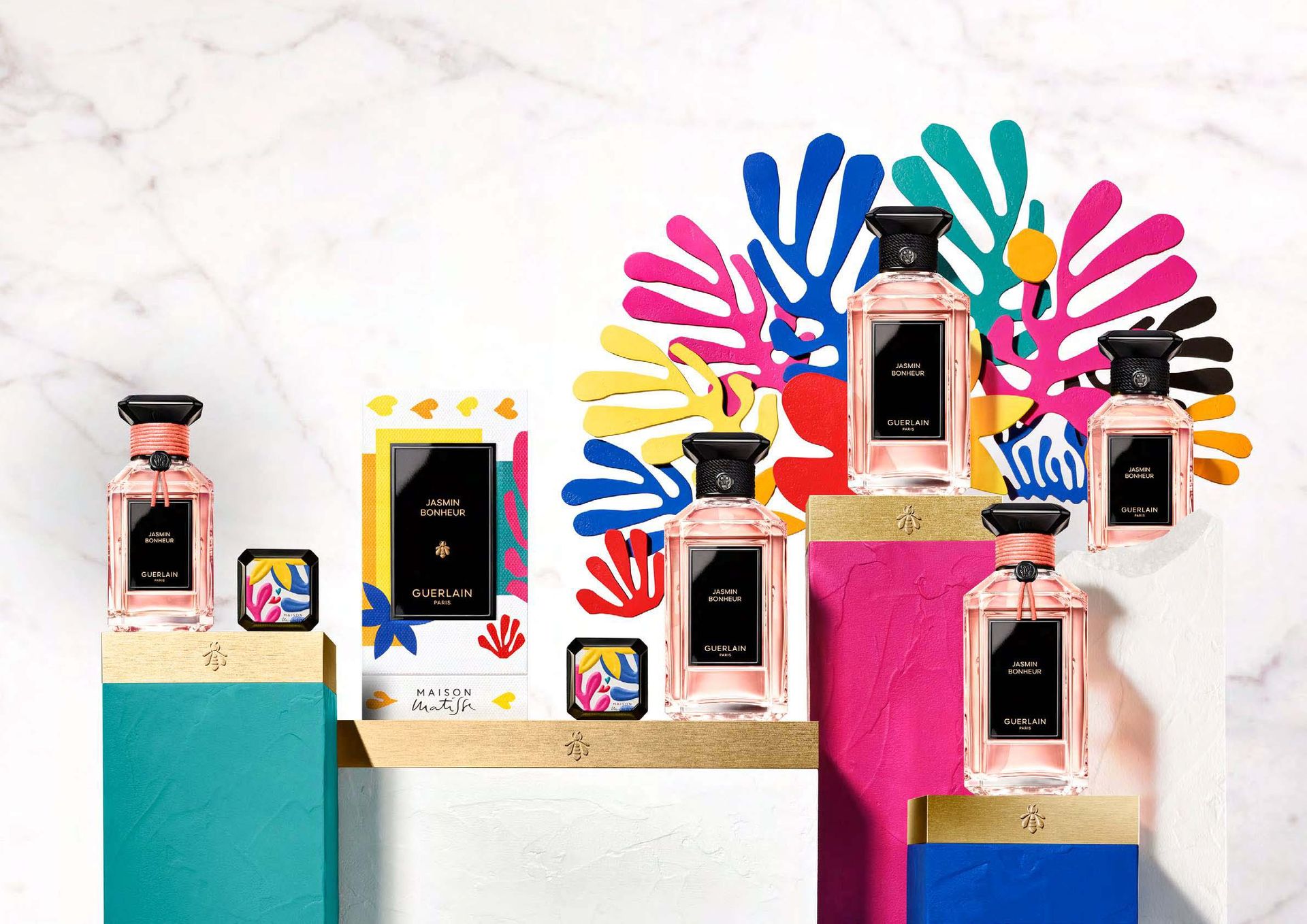 Light pink bottles of Guerlain Jasmin Bonheur fragrance