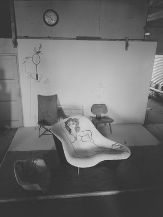 Eames chair with Steinberg cat black and white archive photography