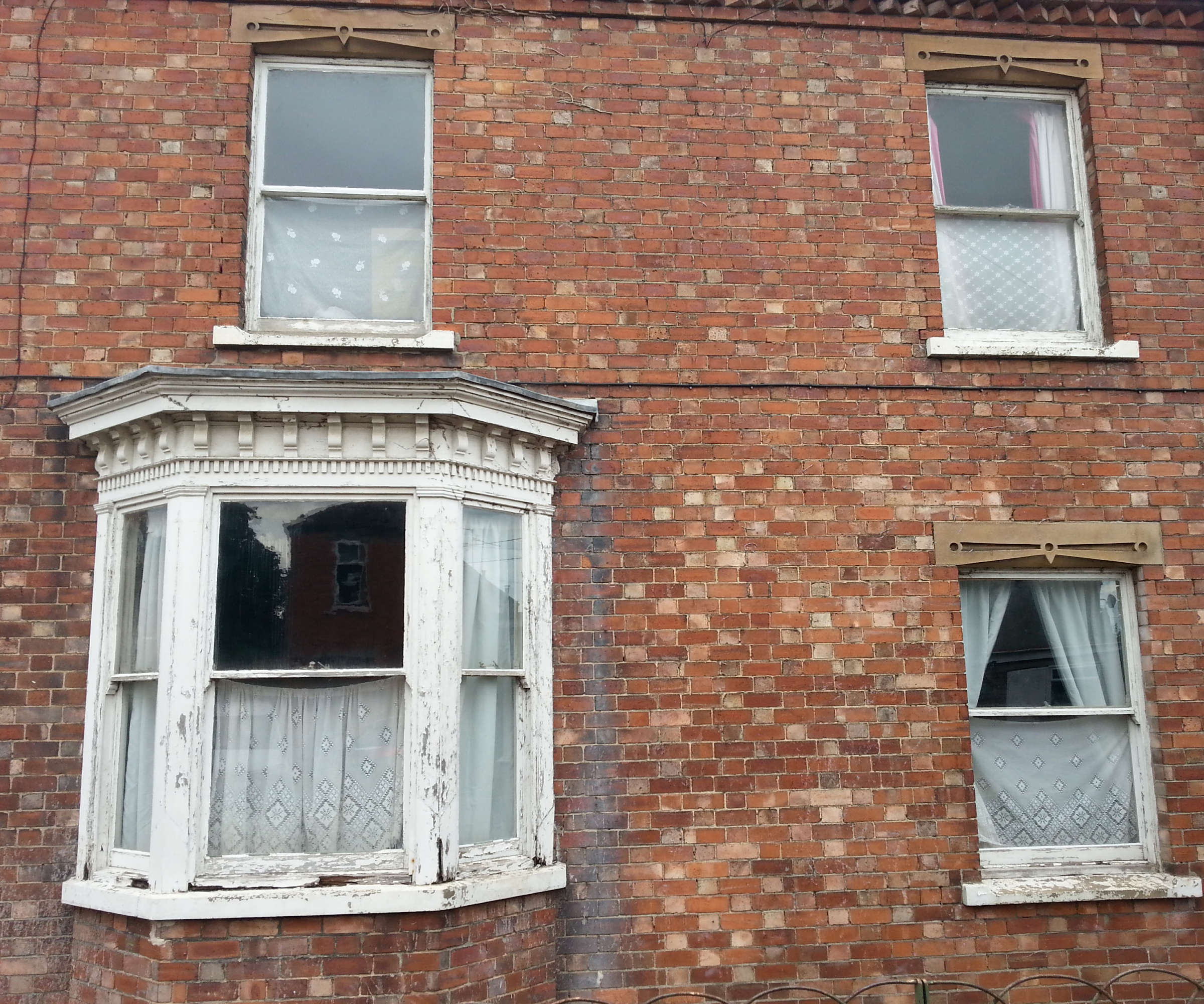 before shot of windows in Victorian house