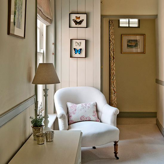 armchair white walls with lamp and white flooring
