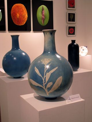 ﻿The collection consists of four products: round vases, slim vases, light shades, and blueprinted tiles