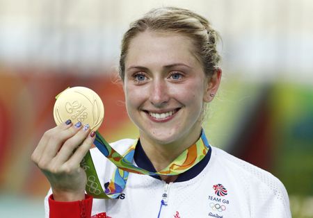 All smiles for Laura Trott as she celebrates her fourth career gold medal