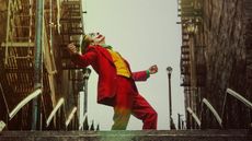 A screenshot of Arthur Fleck dancing on some steps in DC movie Joker