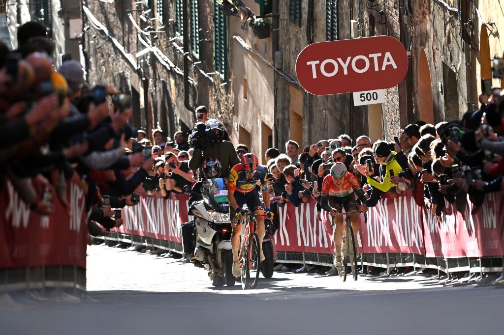 SIENA ITALY MARCH 02 LR Toms Skujins of Latvia and Team Lidl Trek and Maxim Van Gils of Belgium and Team Lotto Dstny compete during the 18th Strade Bianche 2024 Mens Elite a 215km one day race from Siena to Siena 320m UCIWT on March 02 2024 in Siena Italy Photo by Luc ClaessenGetty Images