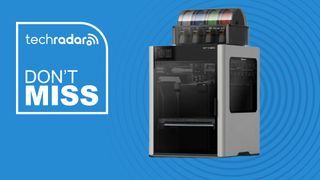 The Bambu Lab H2D 3D printer on a blue background next to a TechRadar badge that reads 'Don't Miss'