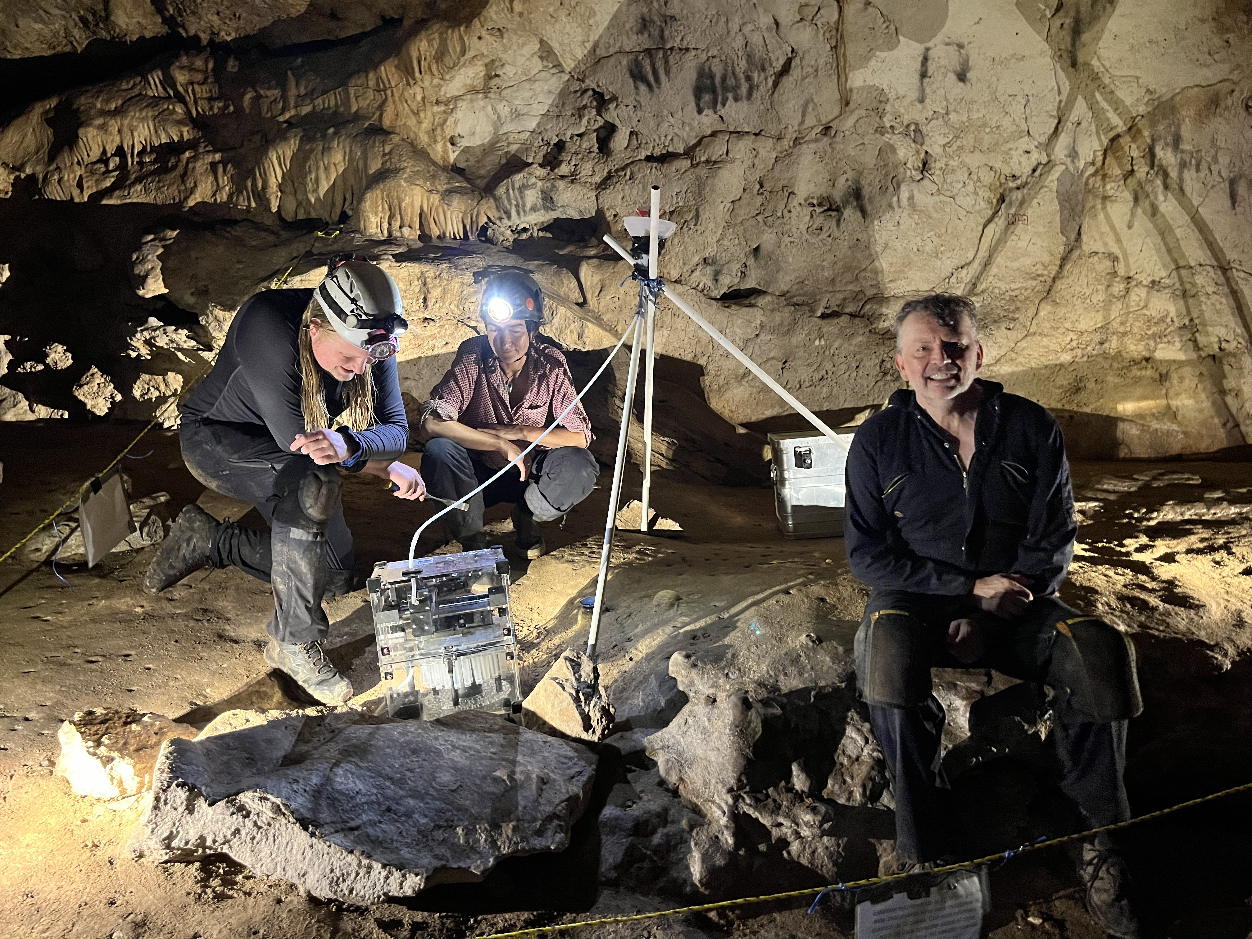 a group of people work in a cave
