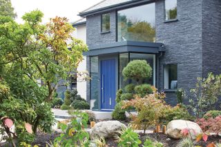 Front door on house exterior by Urban Front