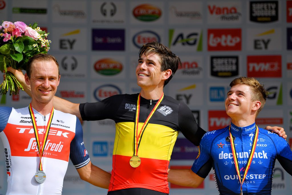 WAREGEM BELGIUM JUNE 20 Edward Theuns of Belgium Silver medal Wout Van Aert of Belgium Gold Medal Belgian Champion Jersey Remco Evenepoel of Belgium Bronze medal celebrates at podium during the 122th Belgian Road Championship 2021 Mens Road Race a 2213km one day race from Waregem to Waregem BELCycling belgiancycling on June 20 2021 in Waregem Belgium Photo by Luc ClaessenGetty Images