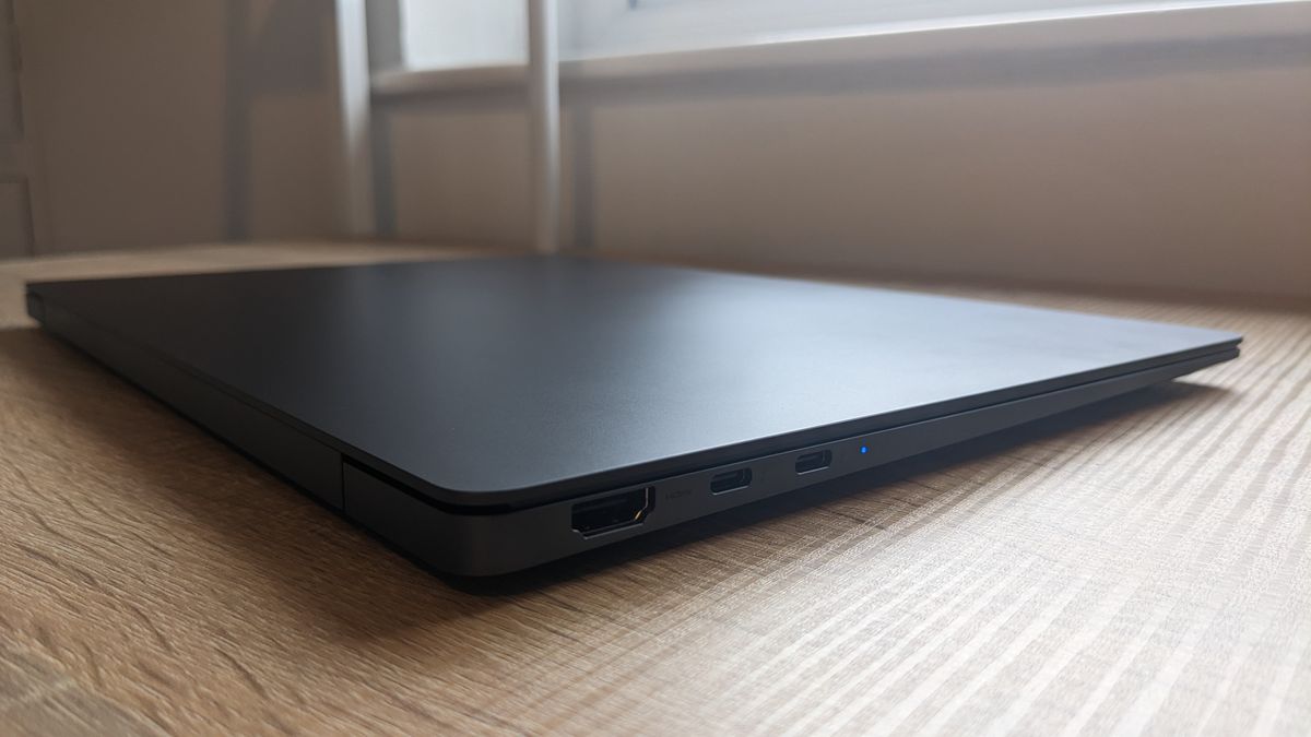 The Samsung Galaxy Book3 Pro 14-inch laptop pictured atop a wooden desk.