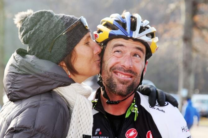 Honorary podium girl Lyne Bessette congratulates the day's winner, Tim Johnson