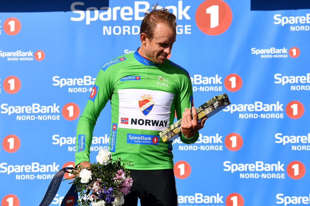 KILPISJARVI FINLAND AUGUST 06 Alexander Kristoff of Norway and Team Norway Green Points Jersey celebrates at podium during the 8th Arctic Race Of Norway 2021 Stage 2 a 178km stage from Nordkjosbotn to Storfjord Kilpisjrvi Finland ArcticRace on August 06 2021 in Kilpisjarvi Finland Photo by Stuart FranklinGetty Images