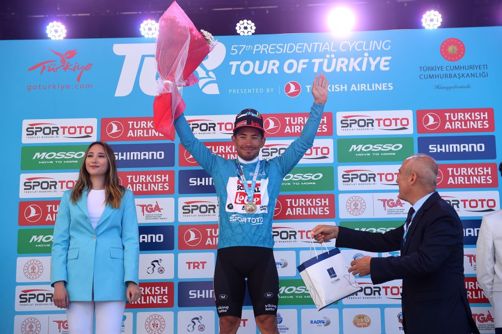 KUSADASI TURKEY APRIL 10 Caleb Ewan of Australia and Team Lotto Soudal celebrates at podium as turquoise leader jersey winner during the 57th Presidential Cycling Tour Of Turkey 2021 Stage 1 a 202km stage from Bodrum to Kuadas TUR2022 on April 10 2022 in Kusadasi Turkey Photo by Dario BelingheriGetty Images