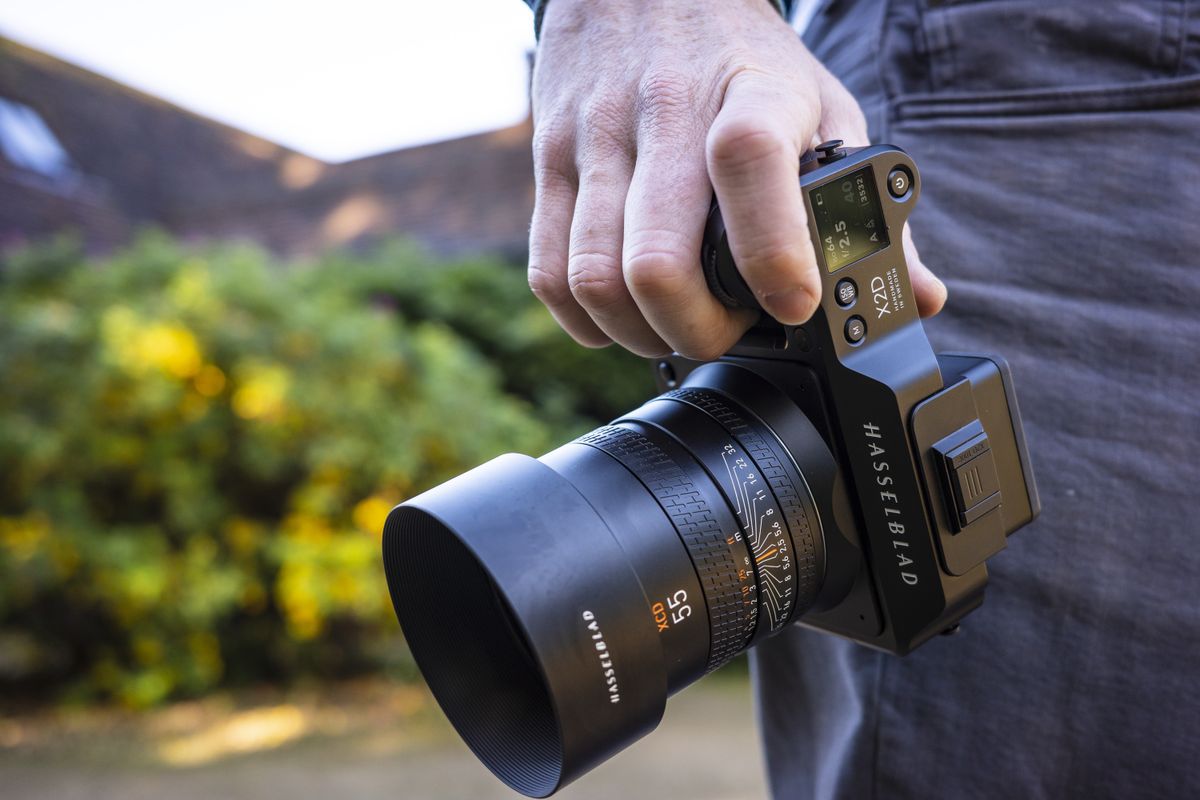 The Hasselblad X2D 100C camera in reviewer's hands