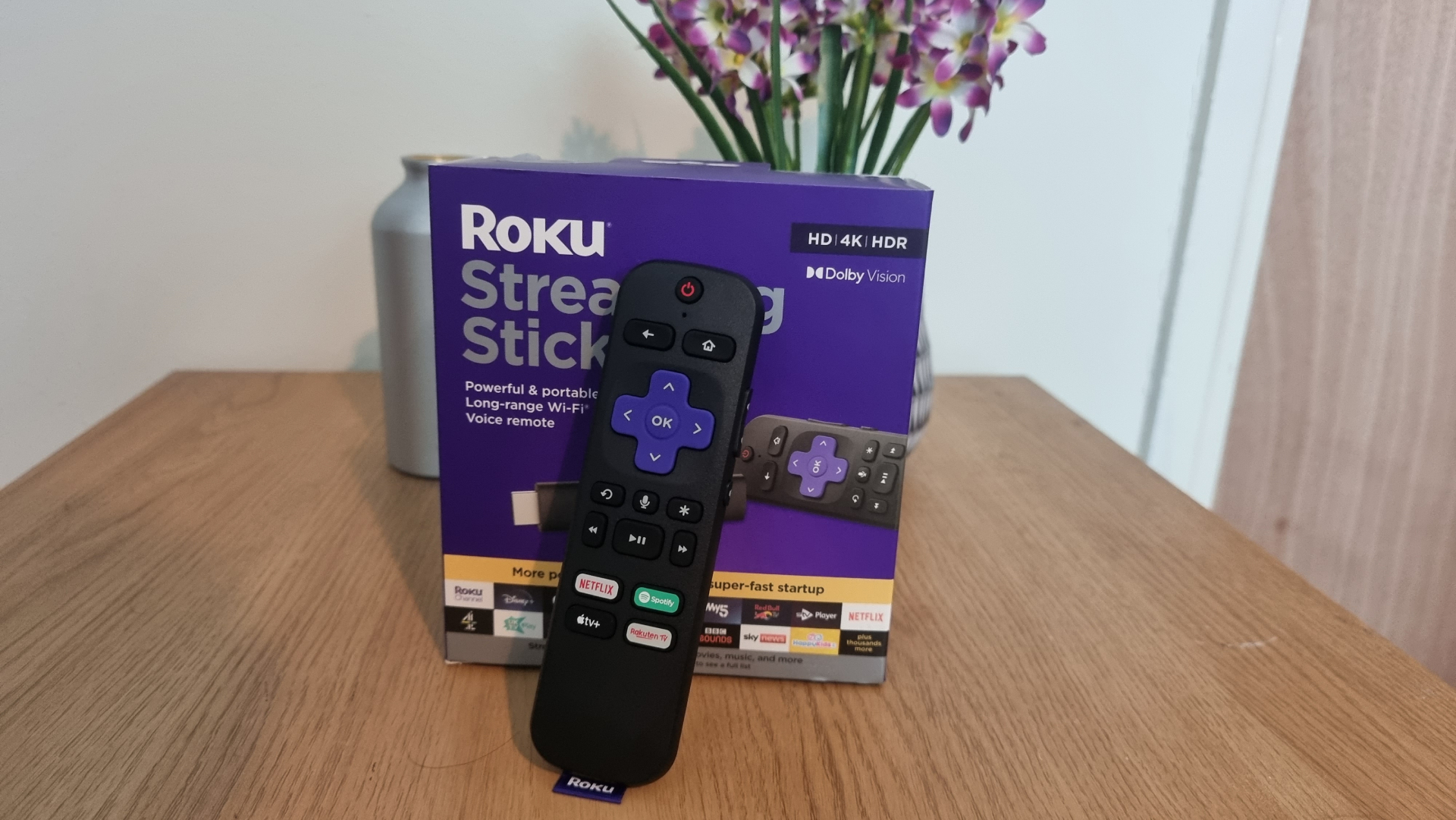 Roku Remote displayed on a table in front of the box