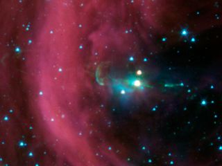 NASA's Spitzer Space Telescope took this image of a baby star sprouting two identical jets (green lines emanating from fuzzy star). The Spitzer image shows that both of the twin jets are made up of identical knots of gas and dust, ejected one after anothe