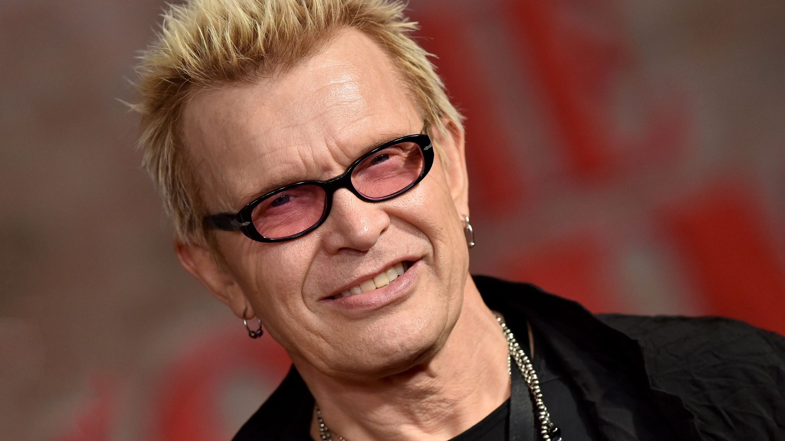 Billy Idol uses natural materials to evoke a modern cabin style in his living room – they're key to feeling 'cozy and cocooned'