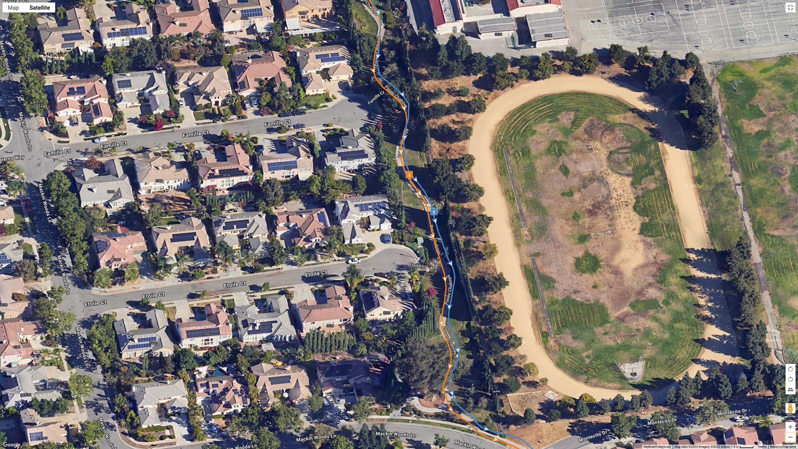 A Google Earth satellite map showing the GPS results for the Garmin Instinct 3 AMOLED (blue line) and Polar Vantage M3 (orange line) for the same run.